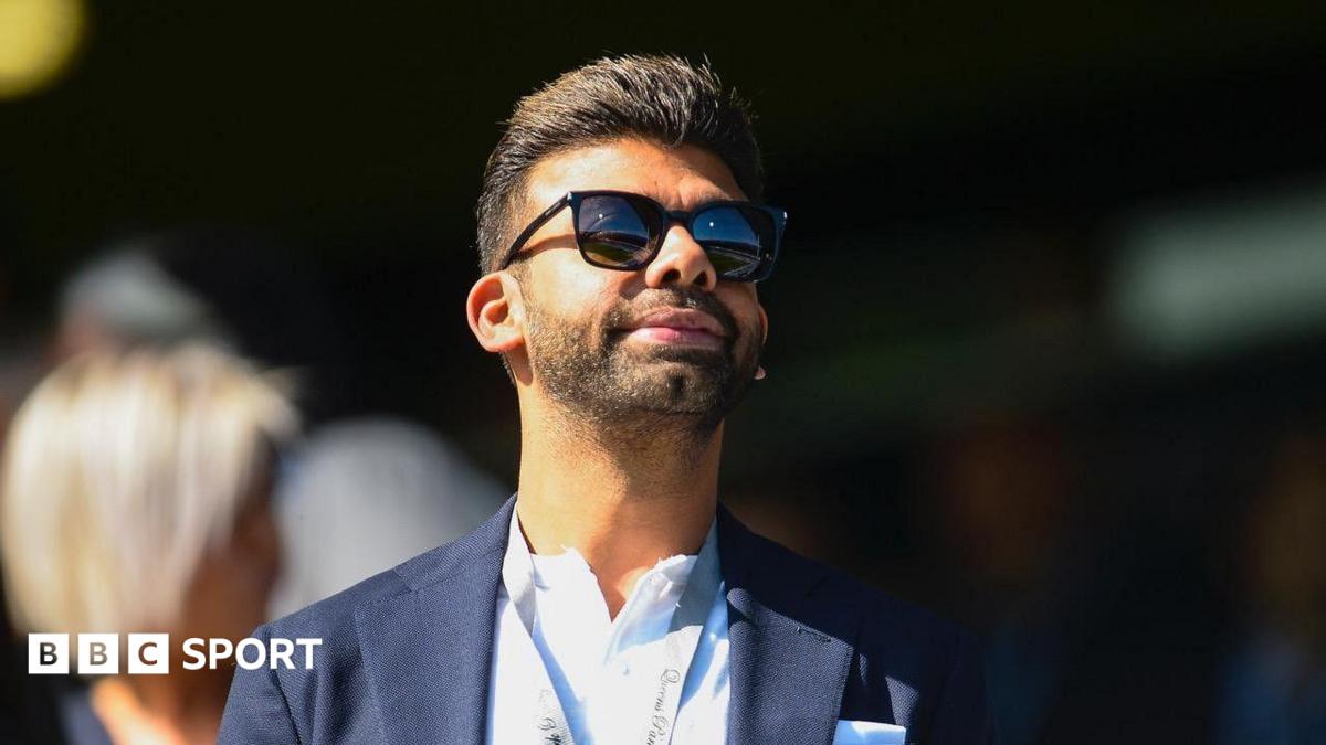 Amit Bhatia looks on from the Loftus Road directors' box during a Championship match